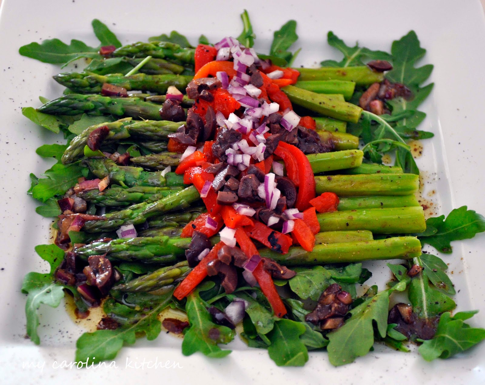 asparagus red peppers on greens
