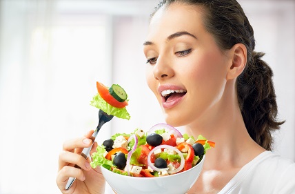 lady eating raw salad